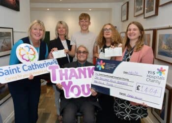 Skydiving Brid pensioner Peter hands over charity cheques
